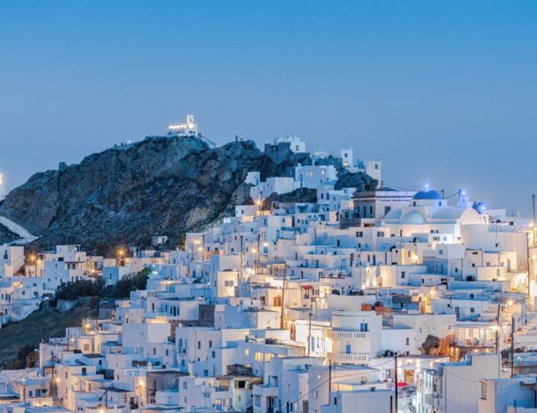 The chora - capital with traditional white houses of Serifos island Aegean Cyclades Greece against a blue sky during blue hour
